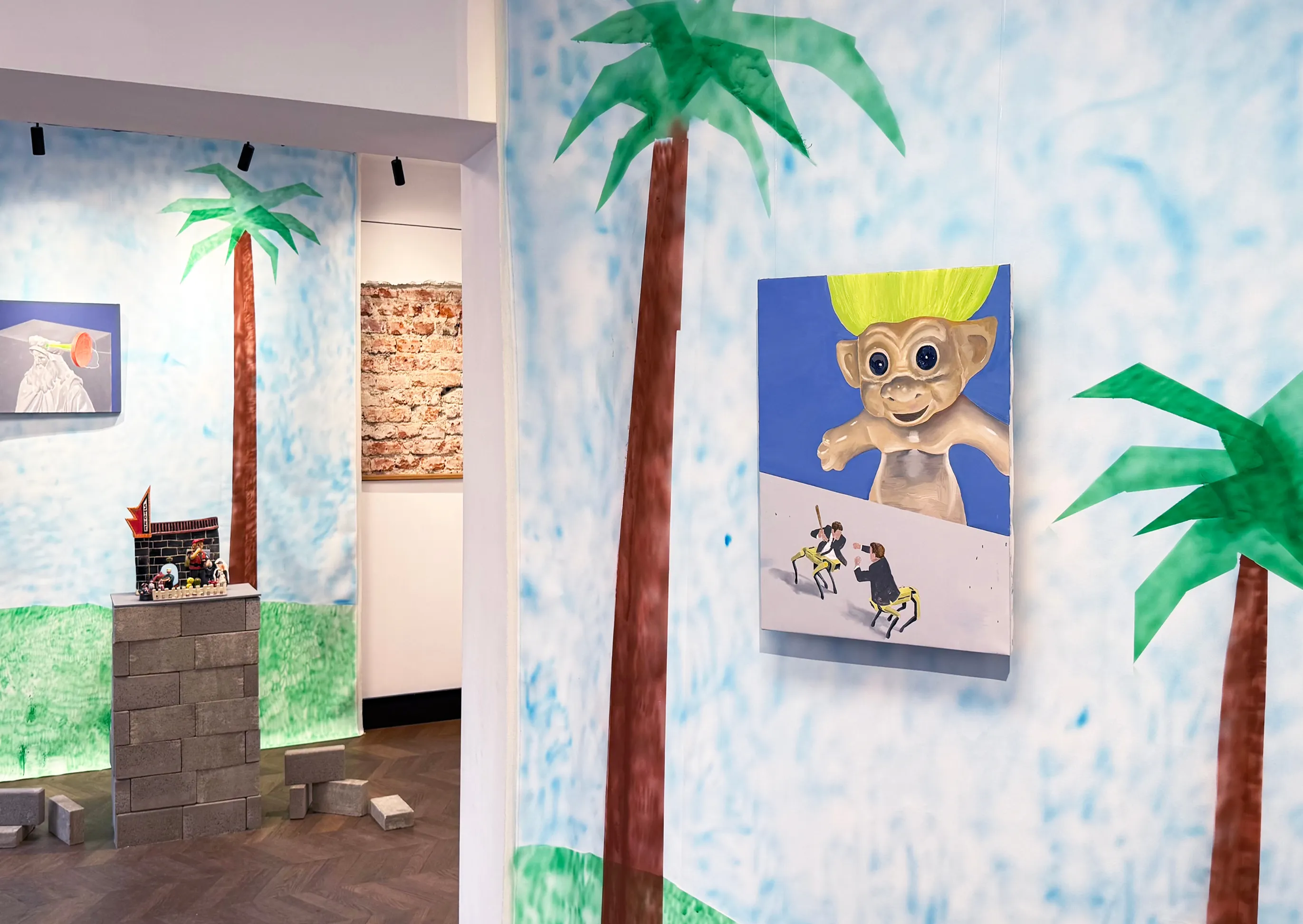 Doomscrolling installation view with a painted backdrop and wall-mounted works